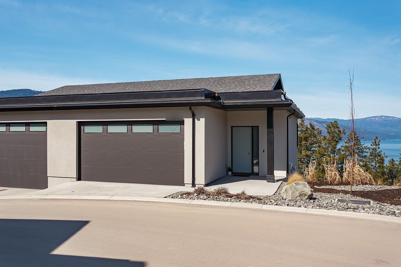 Front of the home with the lake behind
