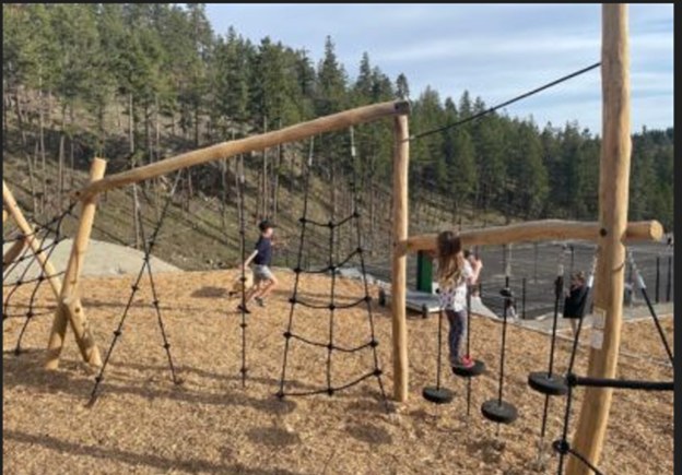 Kids on the rope climbing frame at the playground